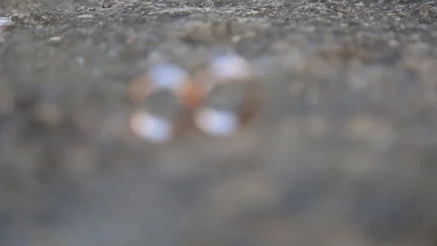 Gold ring lie on the stone surface Видео 123780400