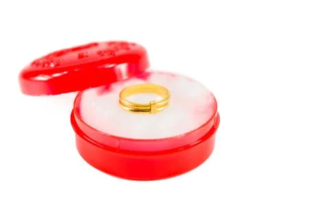 Gold ring on red box Stock Photos