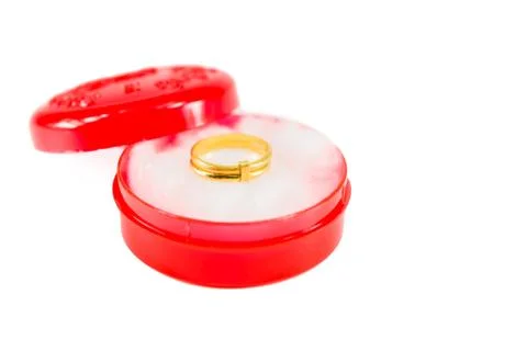 Gold ring on red box Stock Photos
