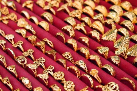 Gold ring on red cloth Stock Photos