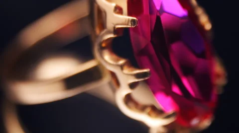 Gold ring with red ruby rotates the mirror surface. Close up Stock Footage 45305639