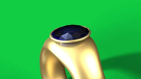 Gold ring rotating after light sweep, camera pulling back, showing blue gem on Stock Footage 339198082
