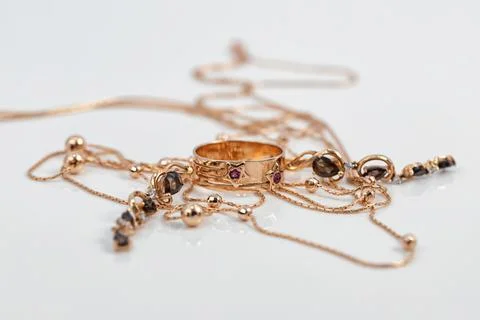 Gold ring with ruby inserts in the shape of stars and ruby earrings Stock Photos