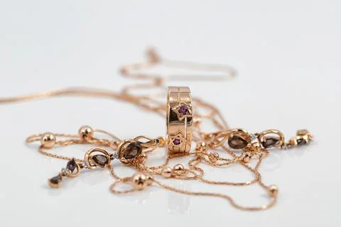 Gold ring with ruby inserts in the shape of stars and ruby earrings Stock Photos