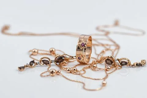 Gold ring with ruby inserts in the shape of stars and ruby earrings Stock Photos