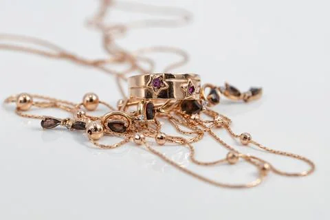 Gold ring with ruby inserts in the shape of stars and ruby earrings Stock Photos