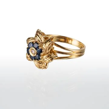 Gold ring with six sapphires Stock Photos