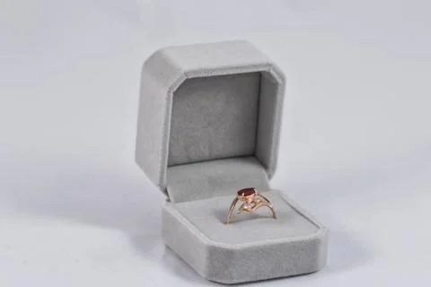 Gold ring with small ruby in gift box 스톡 사진
