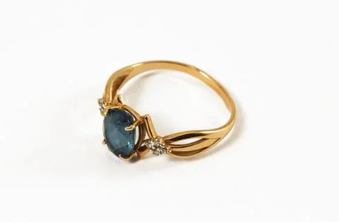 Gold ring with topaz Stock Photos