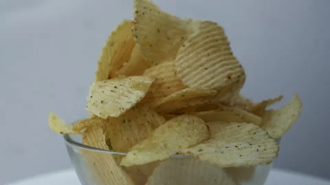 Gold ruffles potato chips rotating close up Stock Footage 139812460