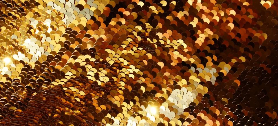 Gold sequin texture background with reflective sparkling . Abstract christmas ba Stock Photos