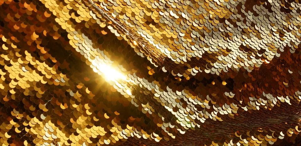 Gold sequin texture background with reflective sparkling . Abstract christmas ba Stock Photos