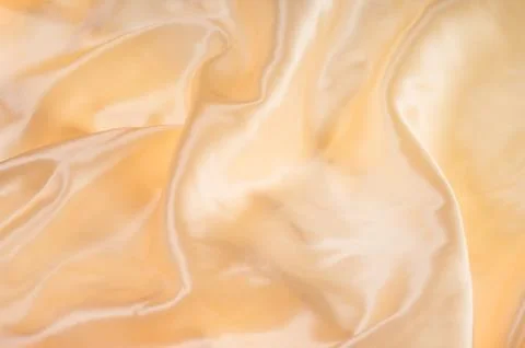 Gold shiny fabric Stock Photos