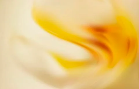 Gold silk background with some soft folds Illustrazione stock