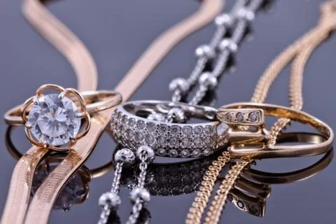 Gold, silver rings and chains Stock Photos