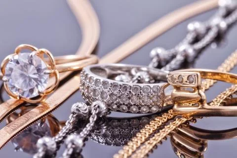 Gold, silver rings and chains Stock Photos
