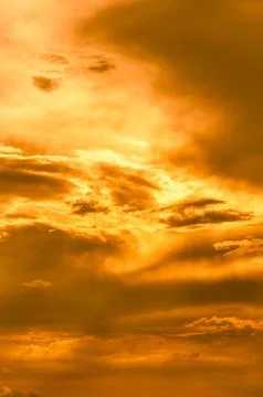 Gold sky background with white clouds Stock Photos