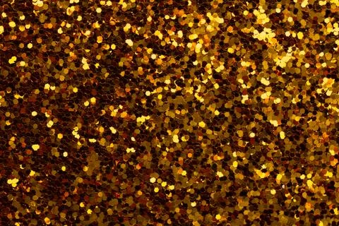 Gold sparkle glitter background. Texture of sequins closeup Stock Photos