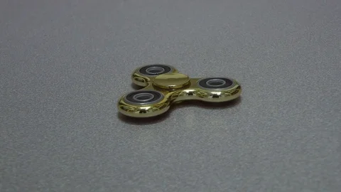 Gold spinner rotate on the white background. Stock Footage 82240736