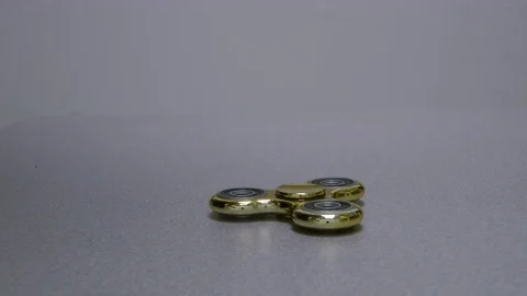 Gold spinner rotate on the white background. Stock Footage 82242012