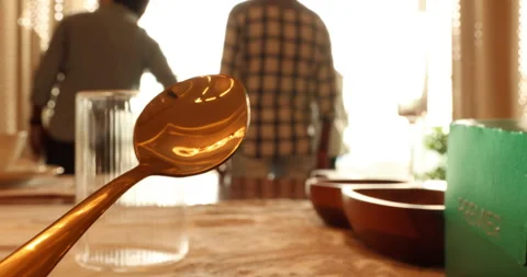 Gold Spoon on a dining table Stock Footage 329620374