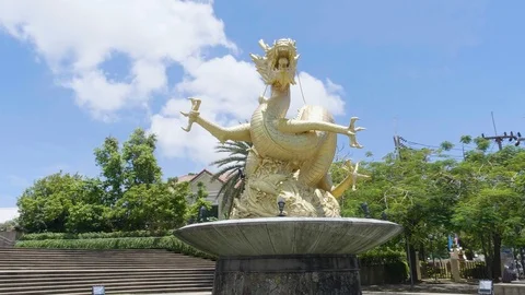 Gold statue of Dragon monument in Phuket Thailand Asian style architecture Stock Footage