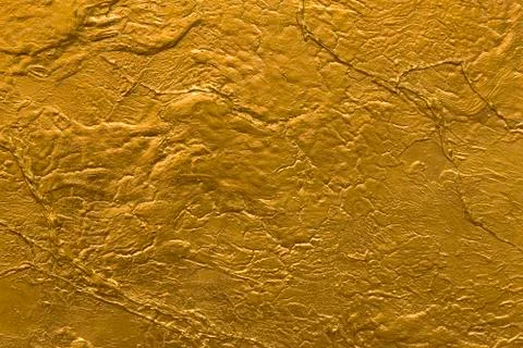 Gold stone wall texture Stock Photos