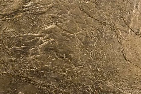 Gold stone wall texture Stock Photos