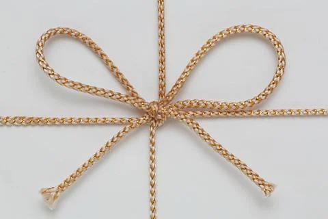 Gold String Bow Small Gold String Bow at Gift Wrap Copyright: xZoonar.com/... Stock Photos