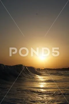 Gold sunset wave Stock Photos