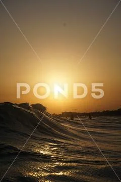 Gold sunset wave Stock Photos
