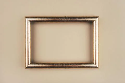 Gold text frame on a beige background. Stock-Fotos