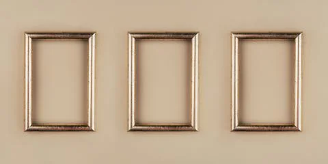 Gold text frames on a beige background. Foto stock