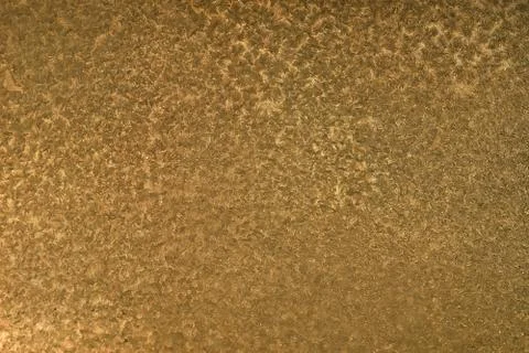 Gold texture background.  patterns on the metal surface Stockfoto's