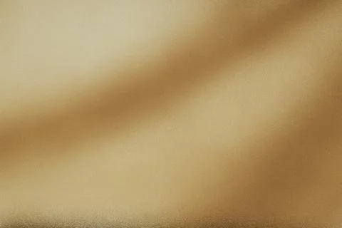 Gold textured surface with flowing waves and soft light Stock Photos