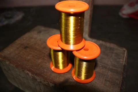 Gold thread being prepared sarees Foto stock