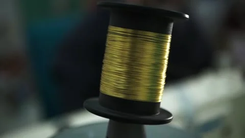 Gold Thread roll rolling stiching tailor Stock Footage 148409329