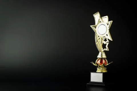 Gold trophy on black Stock Photos