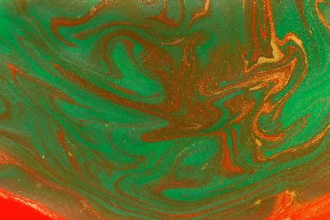 Gold waves on flow red and green paints abstract background. Stock Illustration