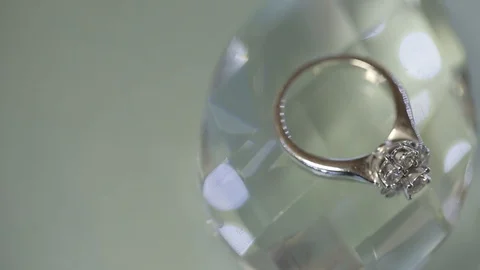Gold Wedding Ring on the crystals macro closeup shoot diamon Jewellery Stock Footage 93719667