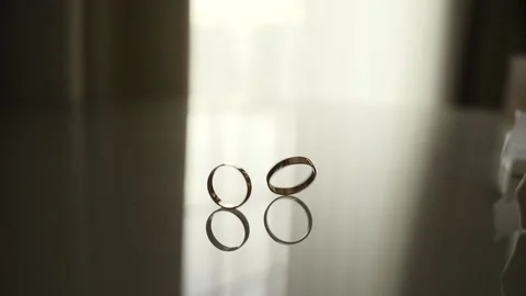 Gold wedding rings Stock Footage 147664818
