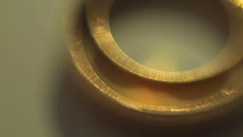 Gold wedding rings on a light background. dream of many girls and women Stock Footage 79237781