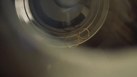 Gold Wedding Rings macro closeup lensflare shoot diamon Jewellery Stock Footage 114485746
