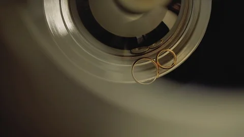 Gold Wedding Rings macro closeup lensflare shoot diamon Jewellery Stock Footage 114485872