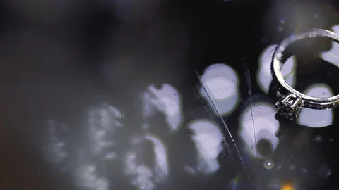 Gold Wedding Rings macro closeup lensflare shoot diamon Jewellery Stock Footage 114486478