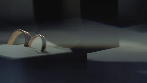 Gold Wedding Rings macro closeup lensflare shoot diamon Jewellery Stock Footage 114487046