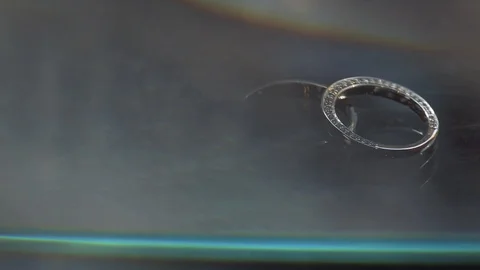 Gold Wedding Rings macro closeup lensflare shoot diamon Jewellery Stock Footage 114487884