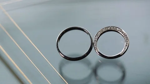Gold Wedding Rings macro closeup lensflare shoot diamon Jewellery Stock Footage 114488022