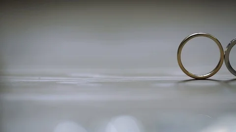 Gold Wedding Rings macro closeup lensflare shoot diamon Jewellery Stock Footage 114494226