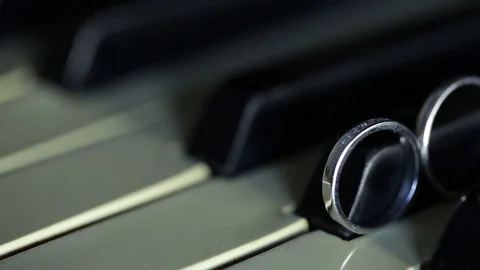 Gold Wedding Rings macro closeup on a piano musical instrument diamon Jewellery Stock Footage 114496383